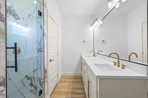 a bathroom with a sink and a mirror