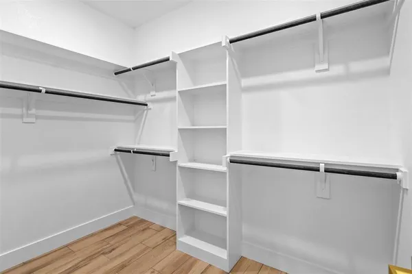 a view of an empty walk in closet