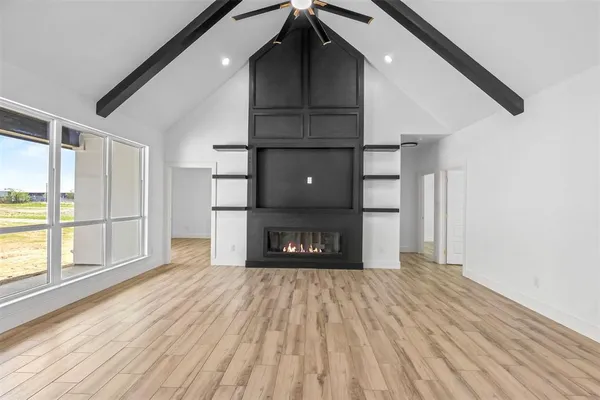 a view of a room with stairs and wooden floor