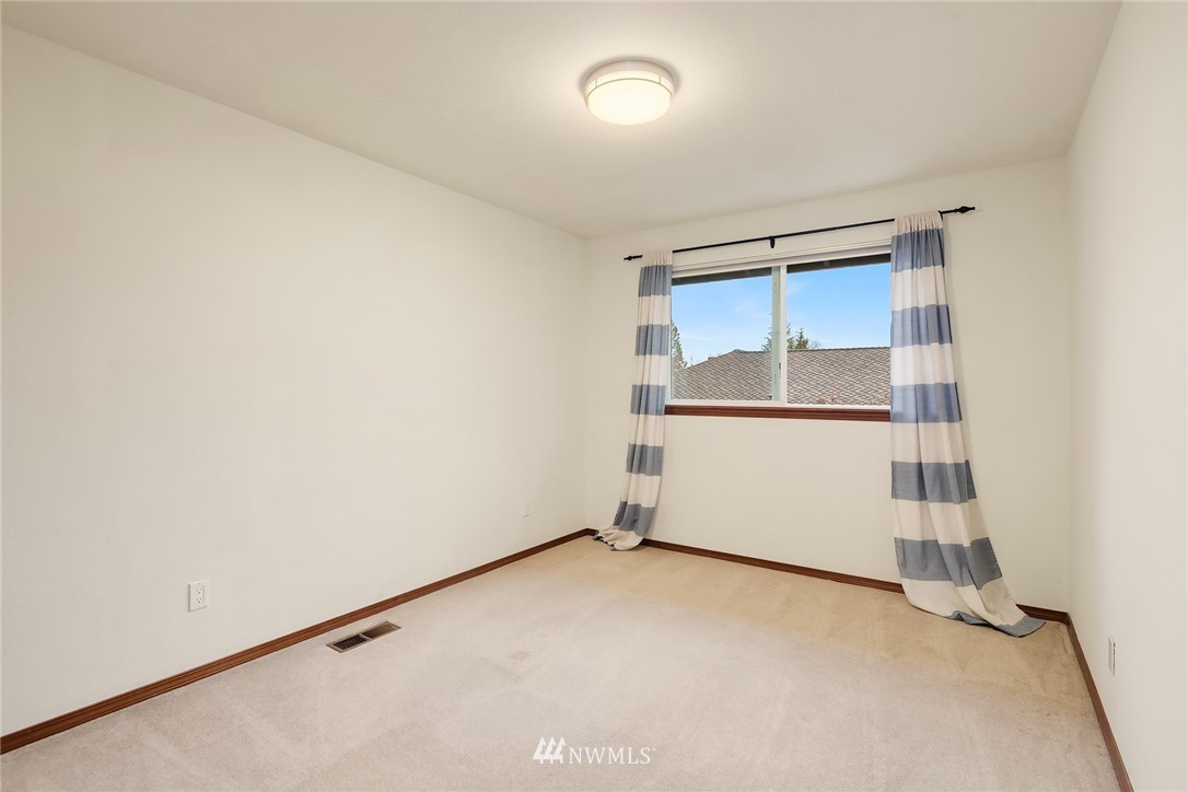 2411 241st Street Southeast Bothell, WA 98021 - Photo 26 of 38 an empty room with a door