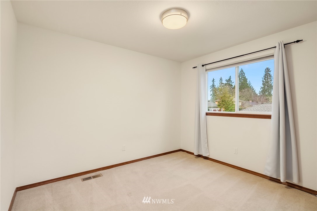 2411 241st Street Southeast Bothell, WA 98021 - Photo 27 of 38 an empty room with a window
