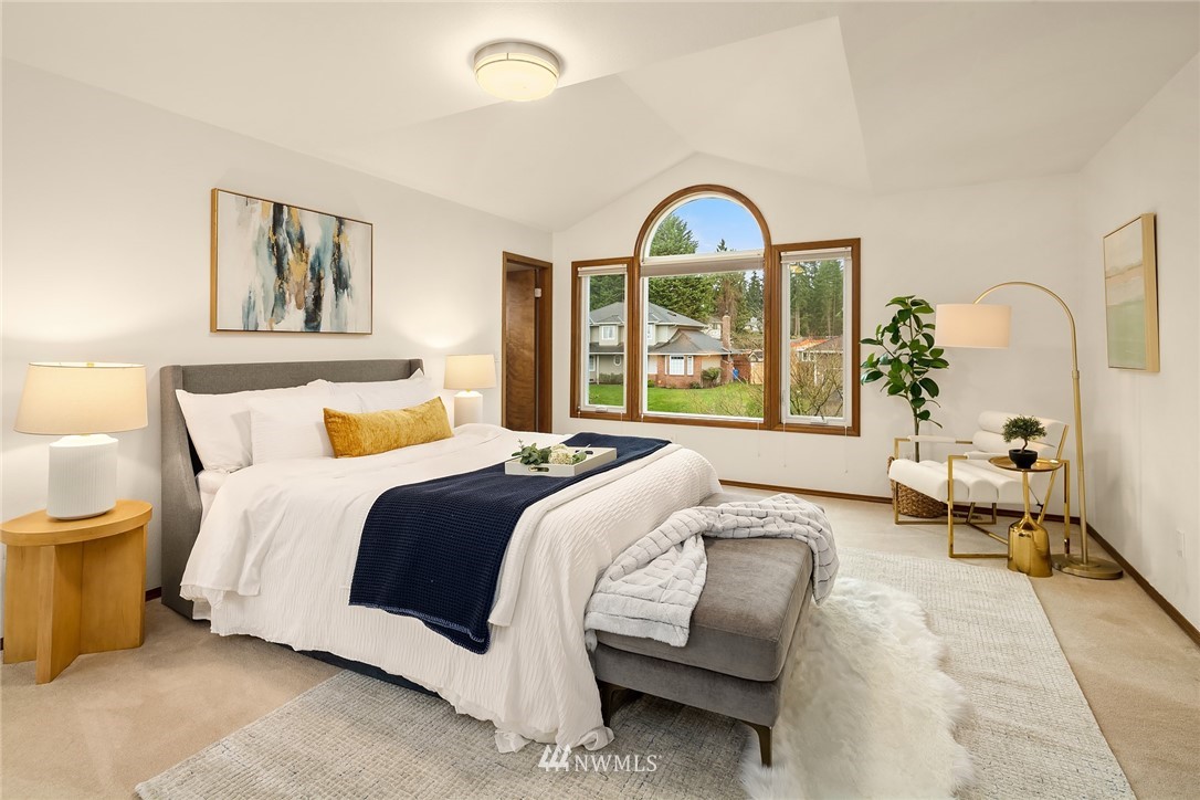 2411 241st Street Southeast Bothell, WA 98021 - Photo 30 of 38 a spacious bedroom with a bed and a couch