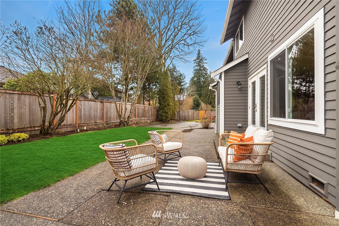 2411 241st Street Southeast Bothell, WA 98021 - Photo 34 of 38 a backyard of a house with table and chairs