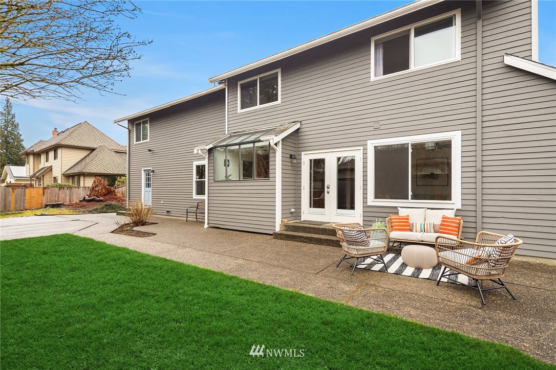 2411 241st Street Southeast Bothell, WA 98021 - Photo 35 of 38 a backyard of a house with table and chairs