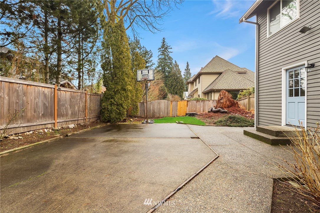 2411 241st Street Southeast Bothell, WA 98021 - Photo 36 of 38 a view of a house with a yard and garage