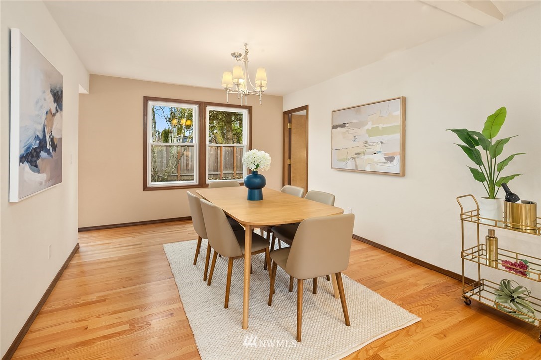 2411 241st Street Southeast Bothell, WA 98021 - Photo 8 of 38 a view of a dining room with furniture window and wooden floor
