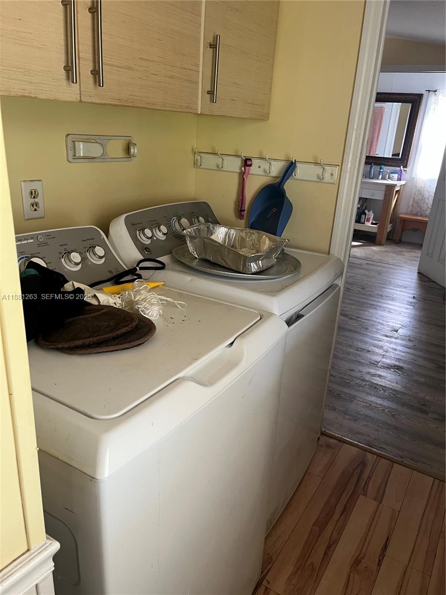 105 Farrer Road Frostproof, FL 33843 - Photo 11 of 48 a kitchen with a stove and wooden floor
