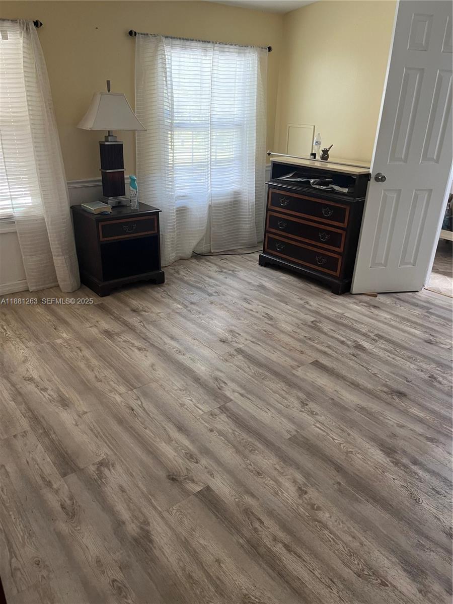 105 Farrer Road Frostproof, FL 33843 - Photo 12 of 48 a living room with furniture and a window