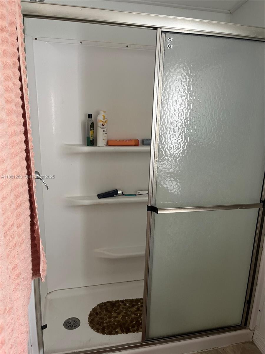 105 Farrer Road Frostproof, FL 33843 - Photo 16 of 48 a bathroom with a shower