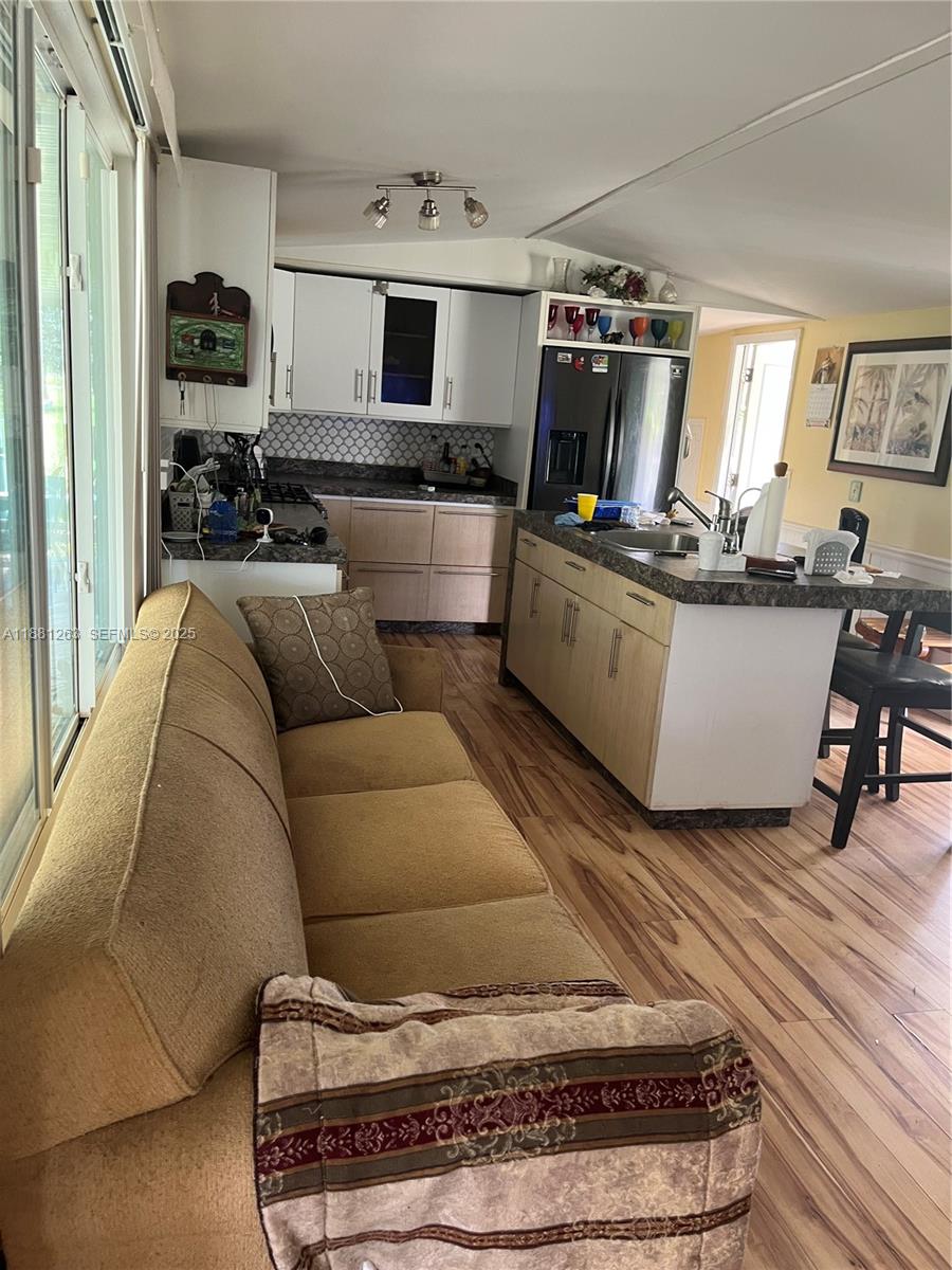 105 Farrer Road Frostproof, FL 33843 - Photo 21 of 48 a living room with furniture and a flat screen tv