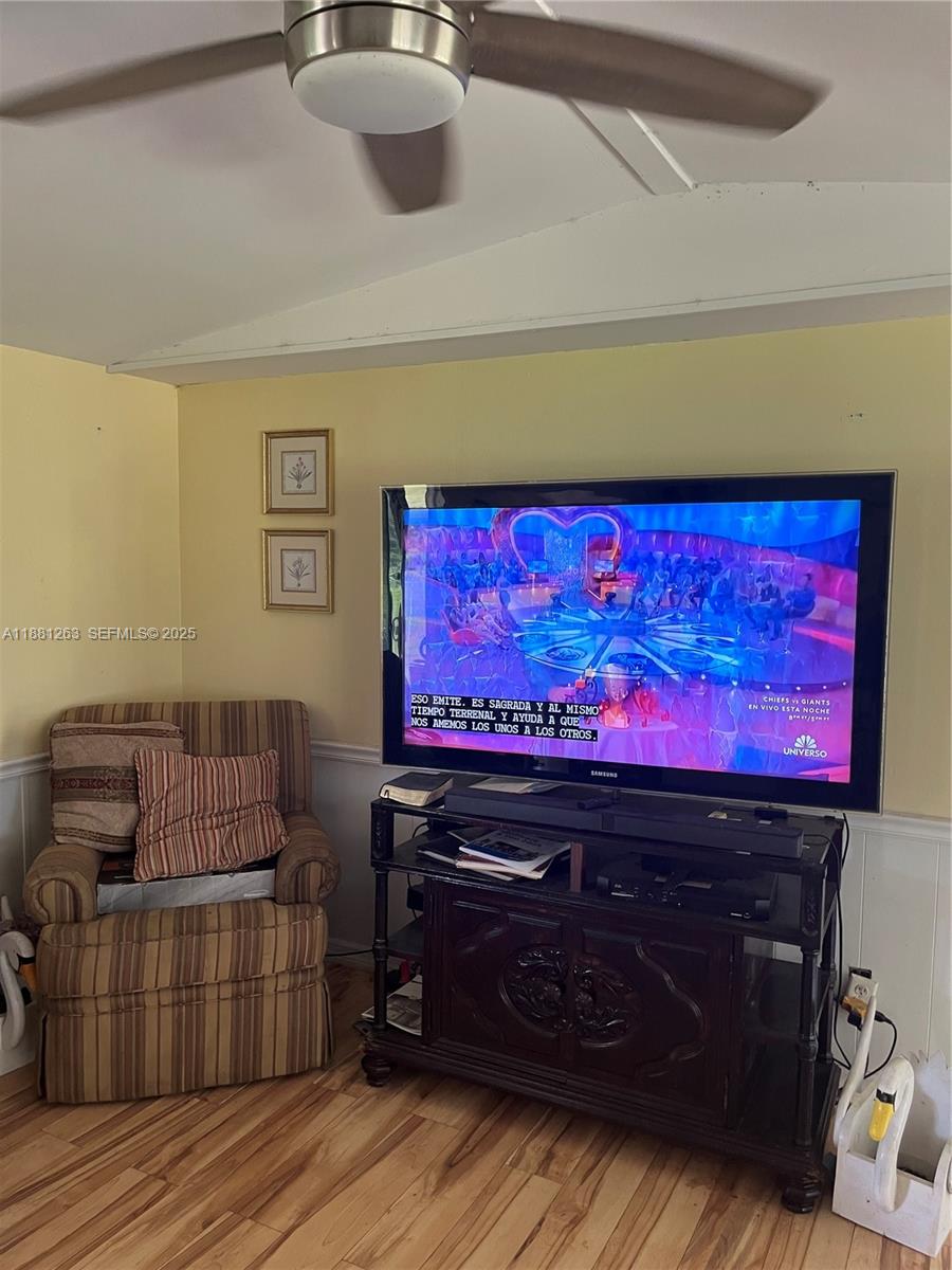105 Farrer Road Frostproof, FL 33843 - Photo 24 of 48 a living room with furniture and a flat screen tv