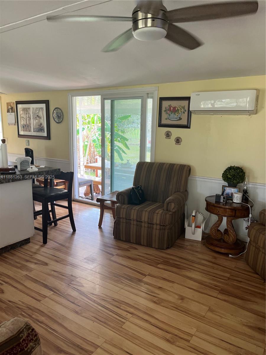 105 Farrer Road Frostproof, FL 33843 - Photo 25 of 48 a living room with furniture and a wooden floor