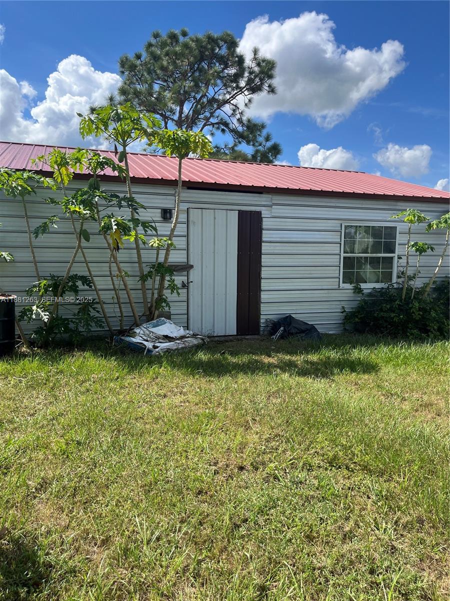 105 Farrer Road Frostproof, FL 33843 - Photo 28 of 48 a view of a backyard