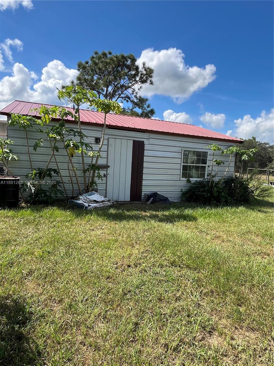 105 Farrer Road Frostproof, FL 33843 - Photo 29 of 48 a view of a house with a garden