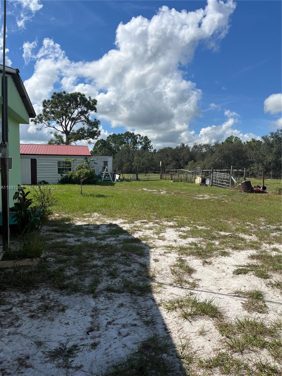 105 Farrer Road Frostproof, FL 33843 - Photo 3 of 48 a view of a lake with a big yard