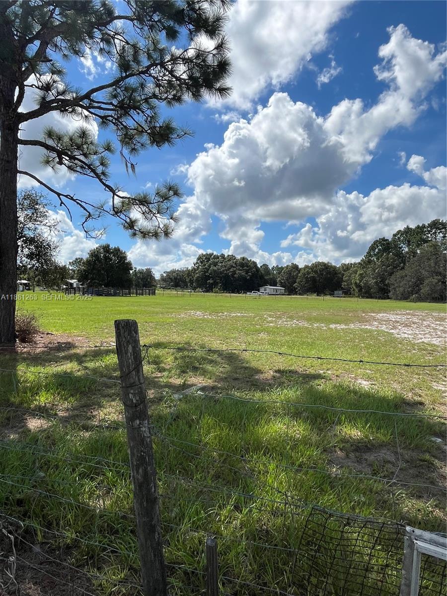 105 Farrer Road Frostproof, FL 33843 - Photo 35 of 48 a view of a golf course with a lake