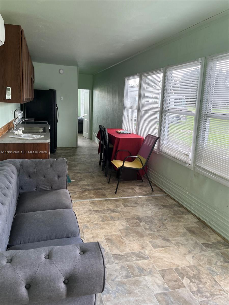 105 Farrer Road Frostproof, FL 33843 - Photo 40 of 48 a living room with furniture and a fireplace