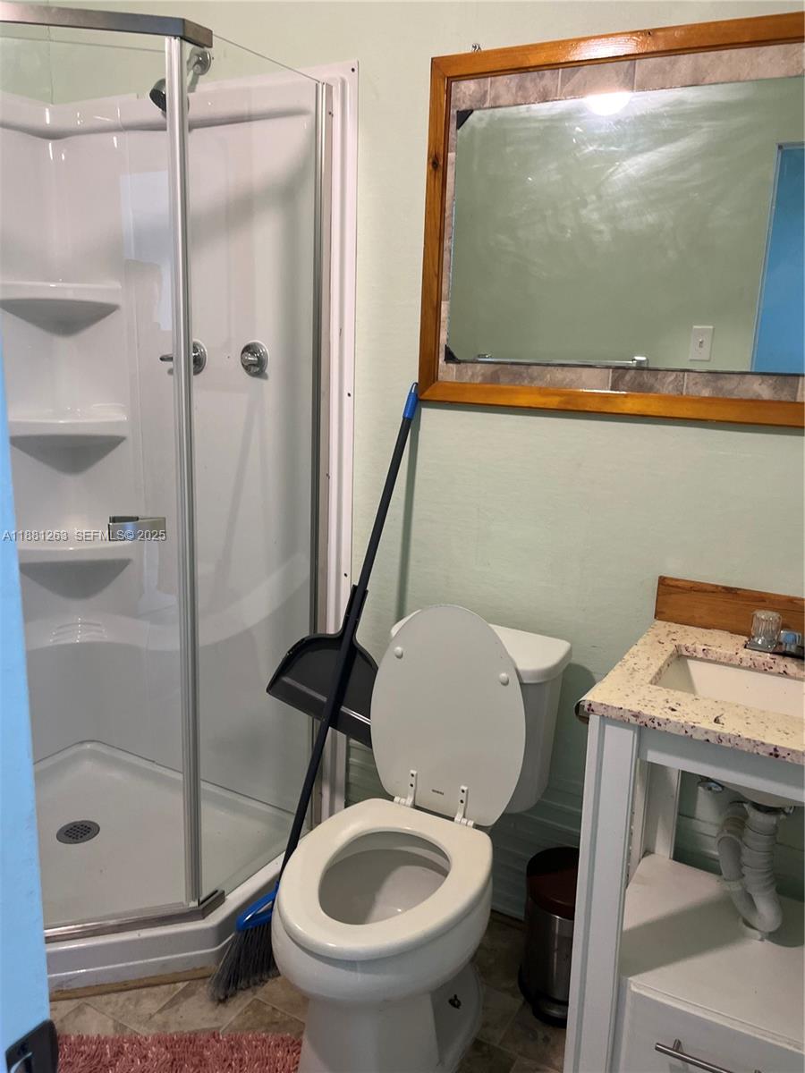 105 Farrer Road Frostproof, FL 33843 - Photo 44 of 48 a bathroom with a toilet and a shower