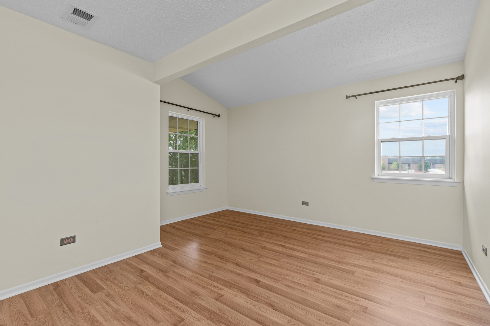 720 Weidner Road, Unit 302 Buffalo Grove, IL 60089 - Photo 19 of 27 wooden floor in an empty room with a window