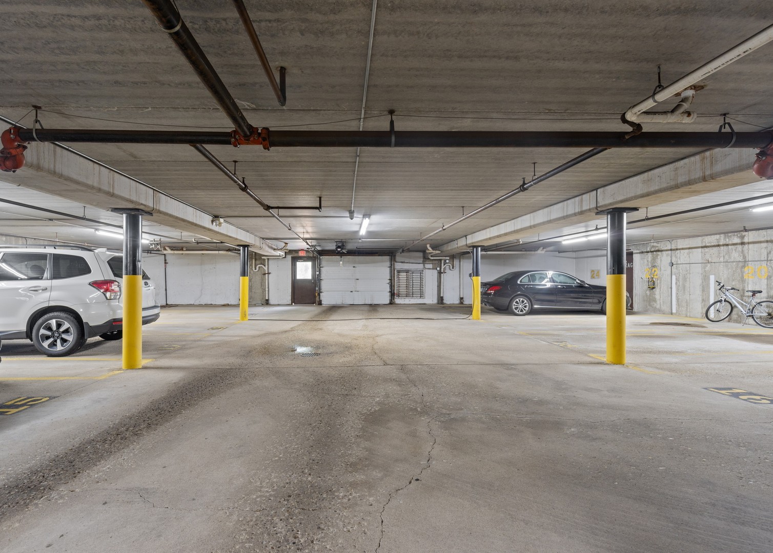 720 Weidner Road, Unit 302 Buffalo Grove, IL 60089 - Photo 27 of 27 a view of parking garage with cars