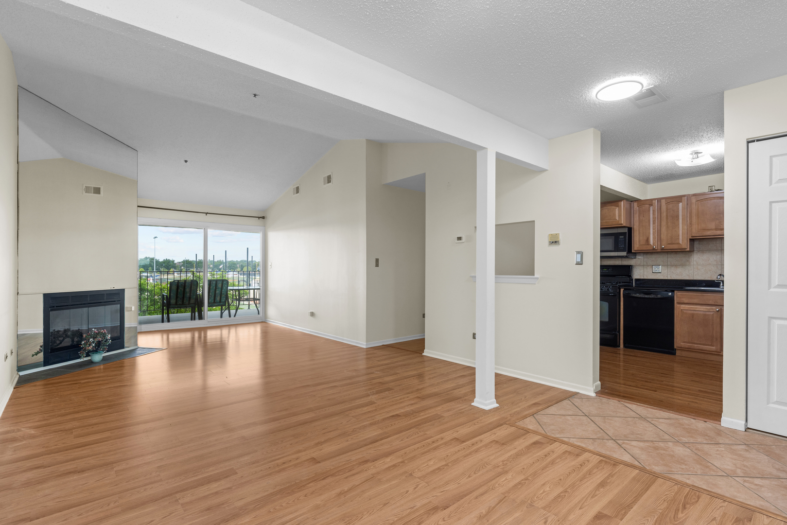 720 Weidner Road, Unit 302 Buffalo Grove, IL 60089 - Photo 5 of 27 a view of a kitchen with a sink and a stove