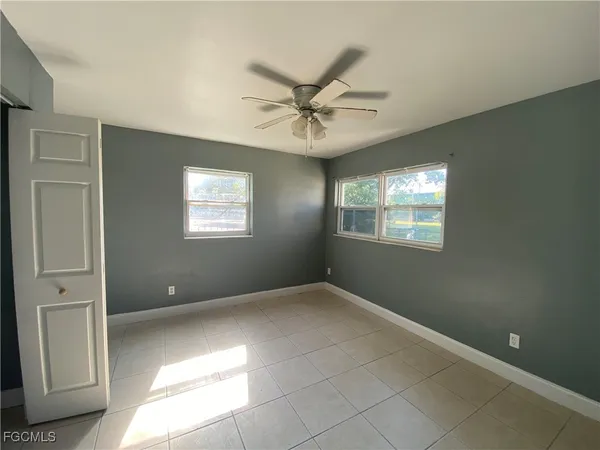 a view of an empty room with a window