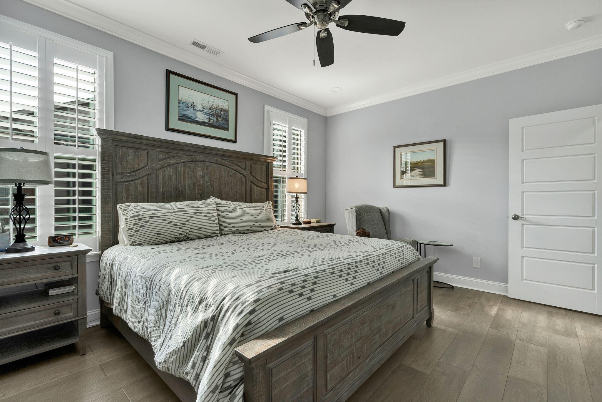 133 Camden Way Dalton, GA 30721 - Photo 16 of 39 a bedroom with a bed and a chandelier