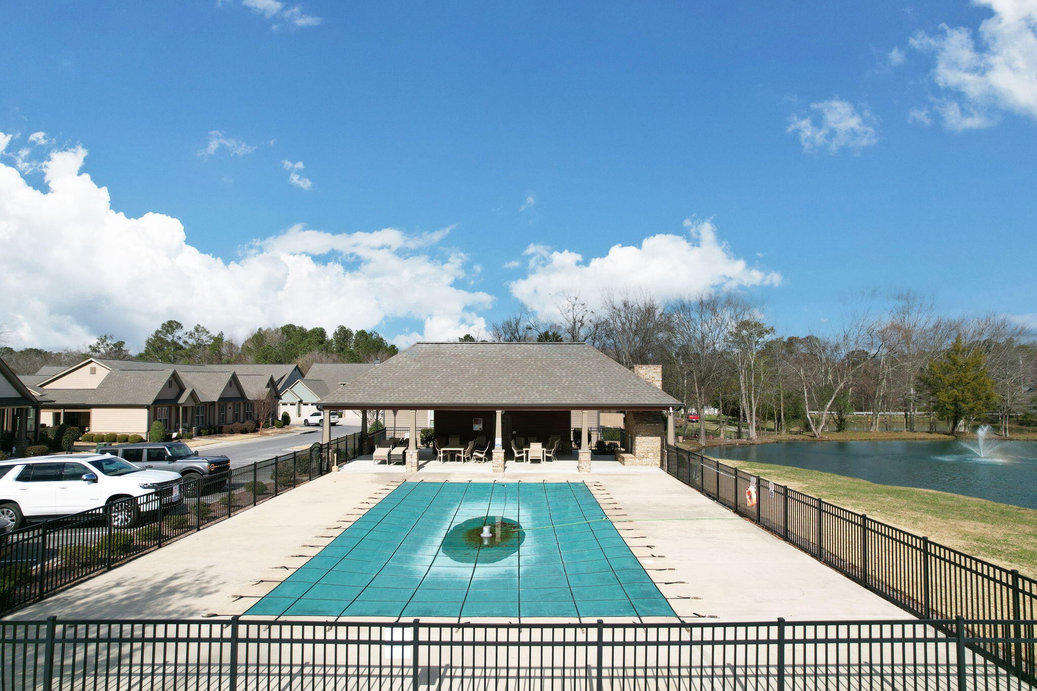 133 Camden Way Dalton, GA 30721 - Photo 33 of 39 a view of swimming pool with lounge chair and dinning table under an umbrella