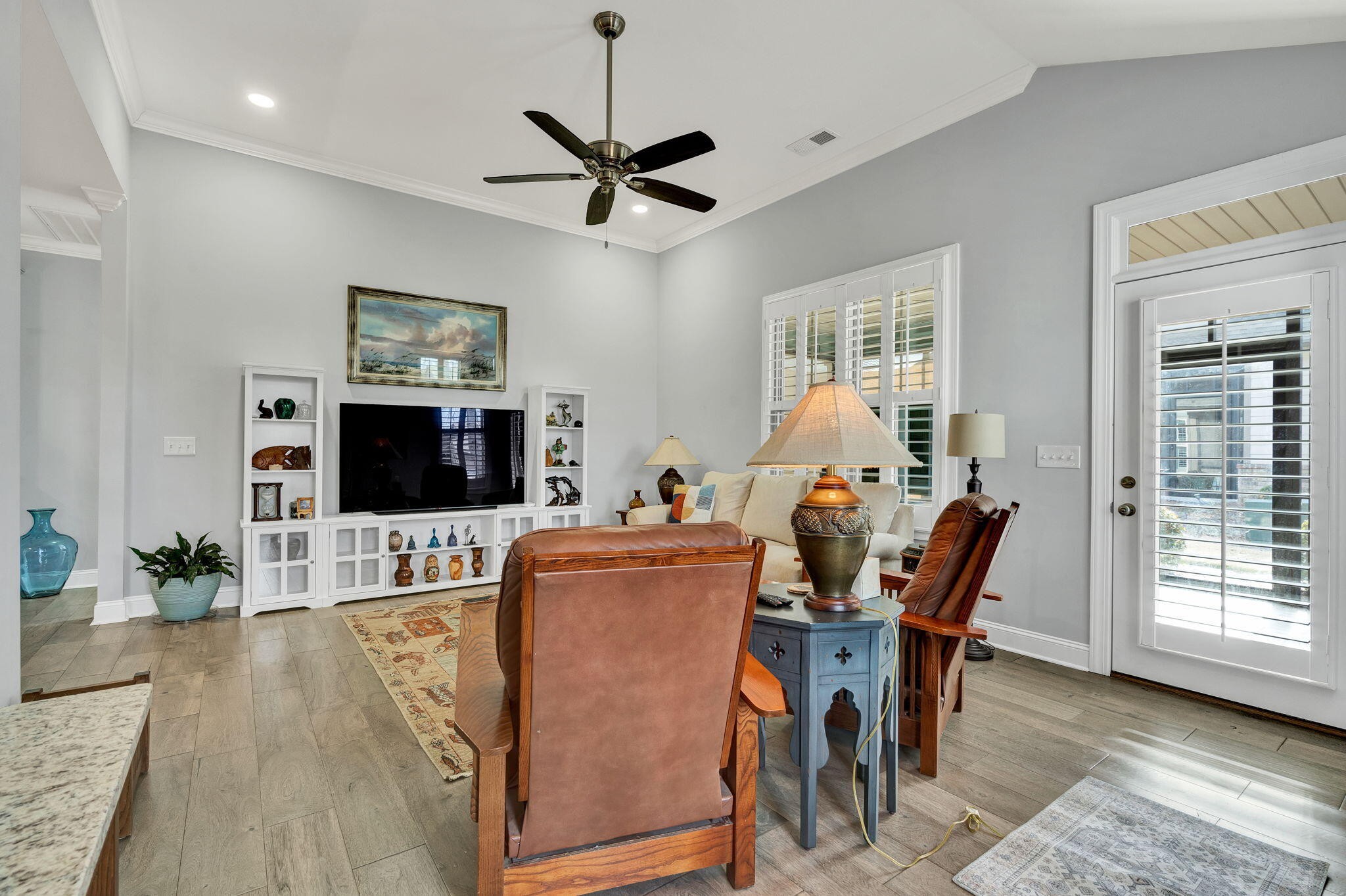 133 Camden Way Dalton, GA 30721 - Photo 7 of 39 a living room with furniture a flat screen tv and a fireplace