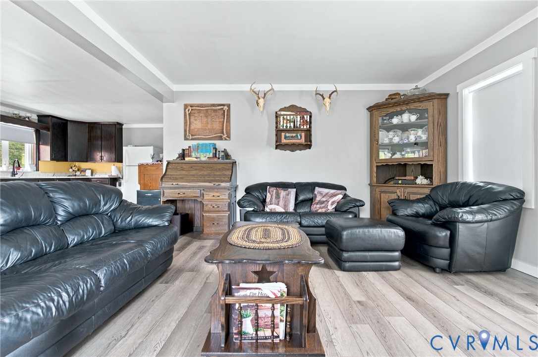 1451 Dixie Hill Road Dillwyn, VA 23936 - Photo 12 of 51 Open-concept living area featuring wood-finish flo