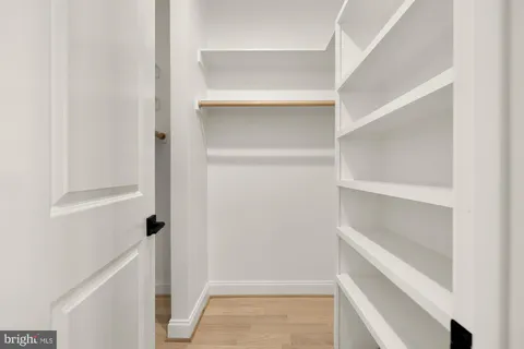 a white toilet sitting next to a bath tub