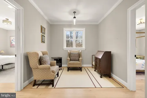 a spacious bedroom with a bed and a window