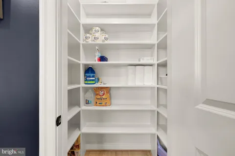 a view of a closet with white door