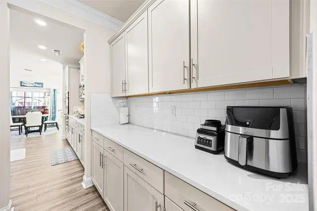 a kitchen with a sink and a stove top oven