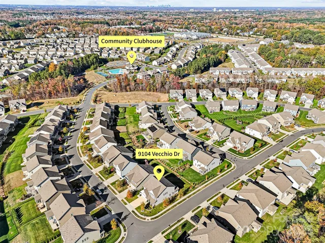 an aerial view of residential building with parking space