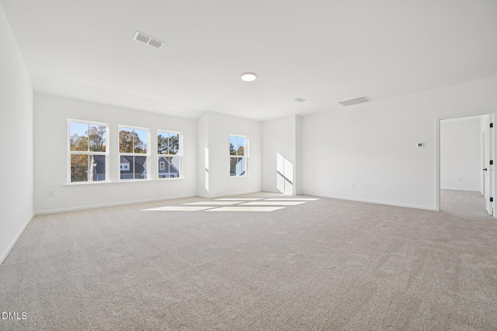 224 South Harvest Rdg Way, Unit HOMESITE 291 Clayton, NC 27520 - Photo 20 of 44 a view of empty room with windows