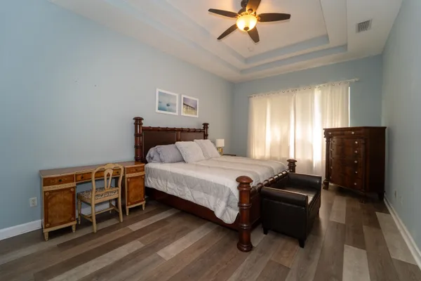 a bedroom with a bed and a mirror