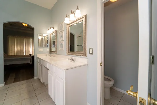 an empty room with a bathroom and a sink