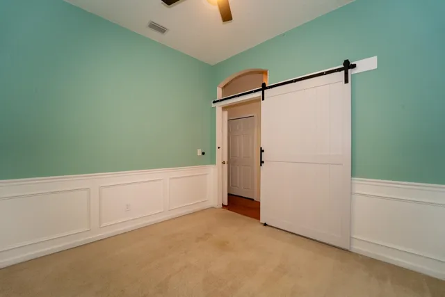 a bed sitting in a room next to a window