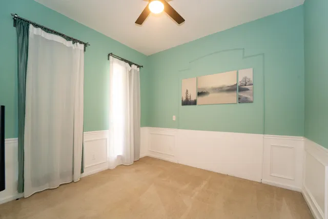 a view of a bedroom with wooden floor and closet