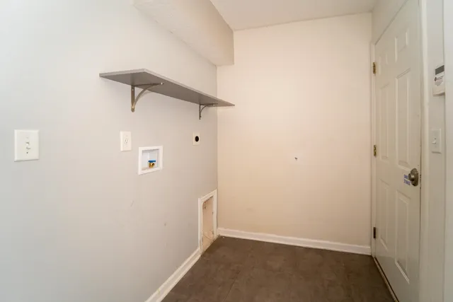 a bedroom with two beds and painting on the wall