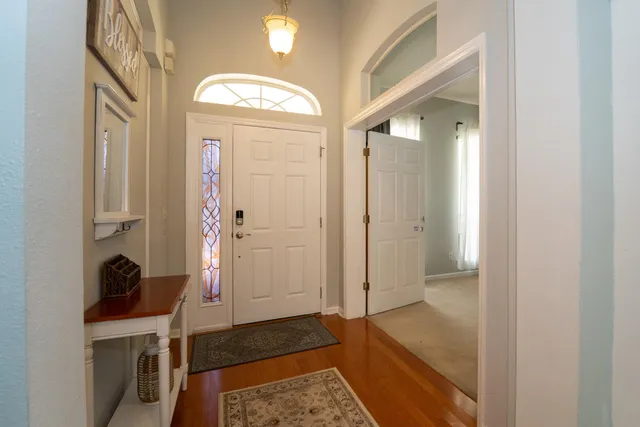 a bedroom with two beds and a window
