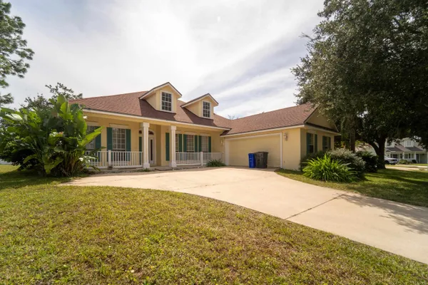 an aerial view of multiple houses with yard
