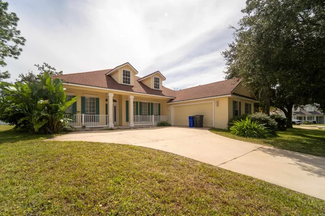 an aerial view of multiple houses with yard