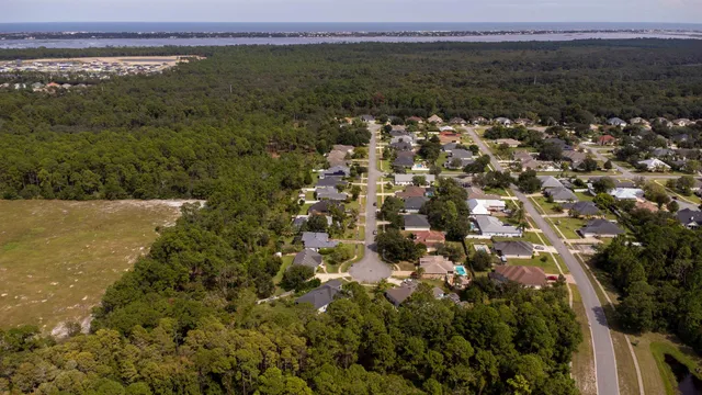 a view of a house with pool and garden