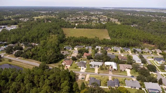 an aerial view of residential houses with outdoor space