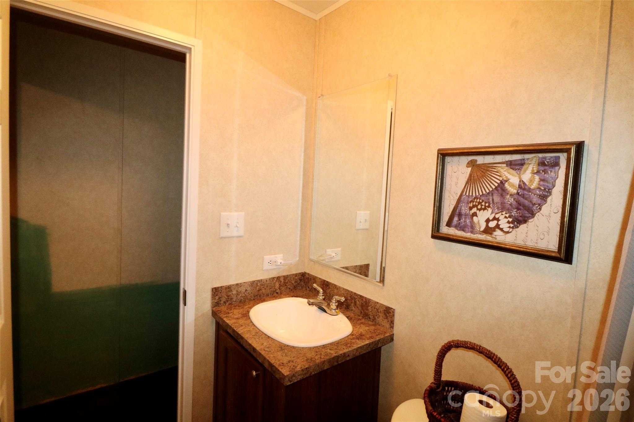 116 Sienna Court Grover, NC 28073 - Photo 15 of 19 a bathroom with a granite countertop sink and a mirror