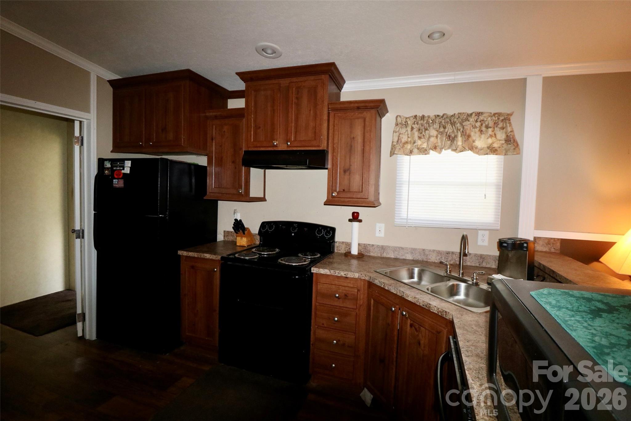 116 Sienna Court Grover, NC 28073 - Photo 6 of 19 a kitchen with granite countertop a refrigerator stove top oven and sink