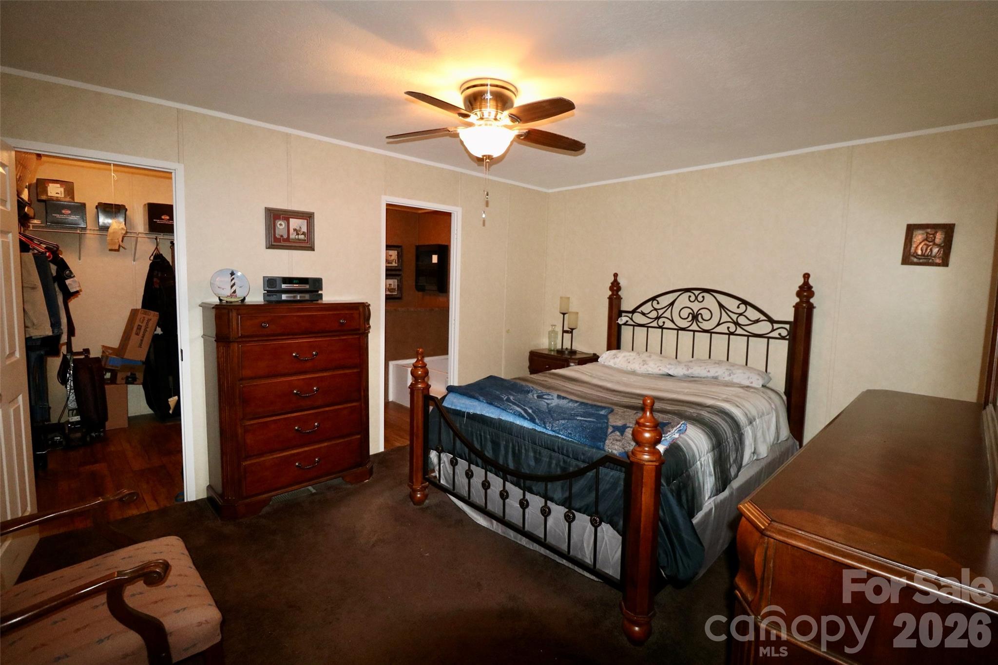 116 Sienna Court Grover, NC 28073 - Photo 8 of 19 a bedroom with a bed and a chandelier