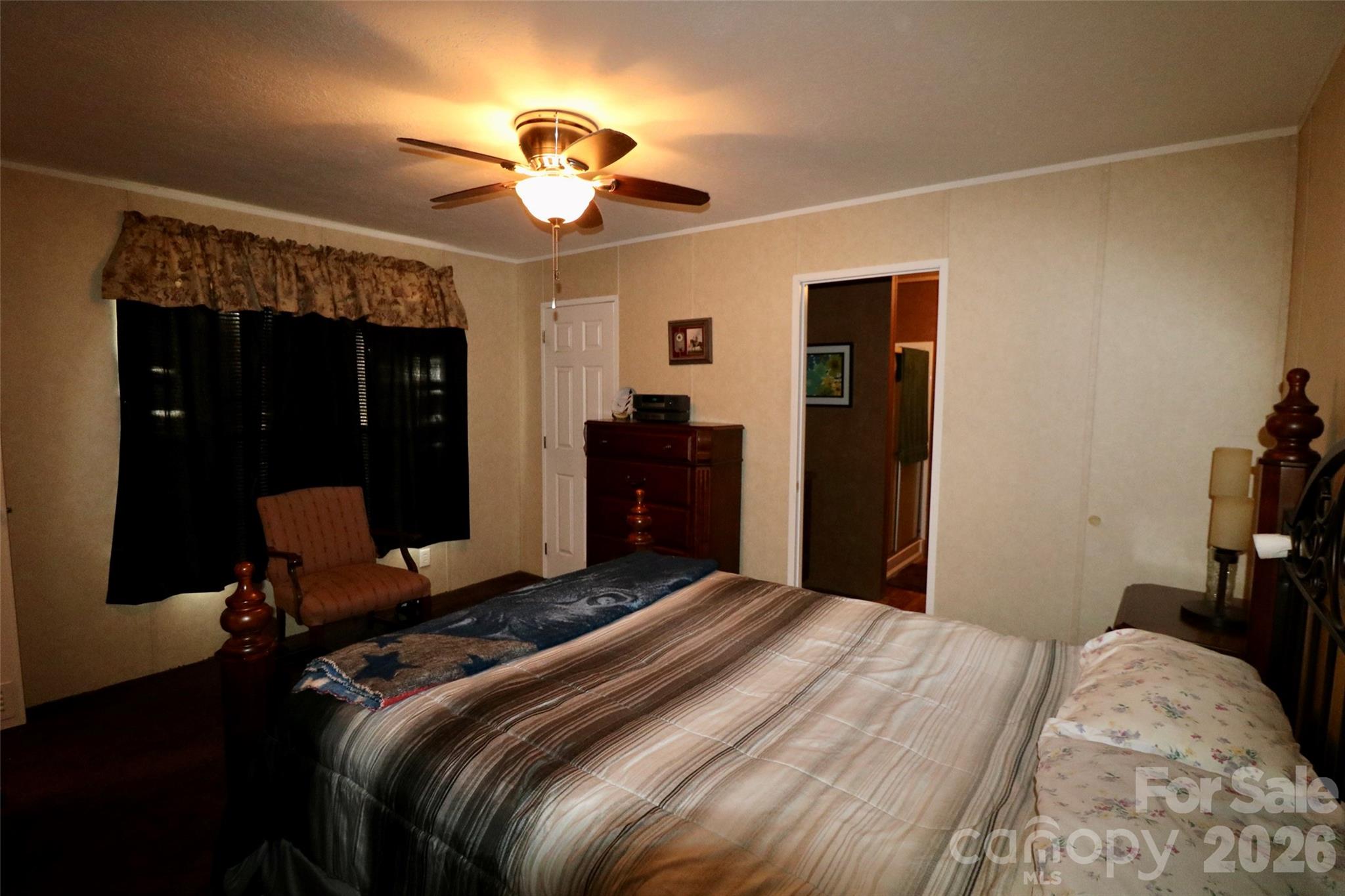 116 Sienna Court Grover, NC 28073 - Photo 9 of 19 a bedroom with a bed and a chandelier